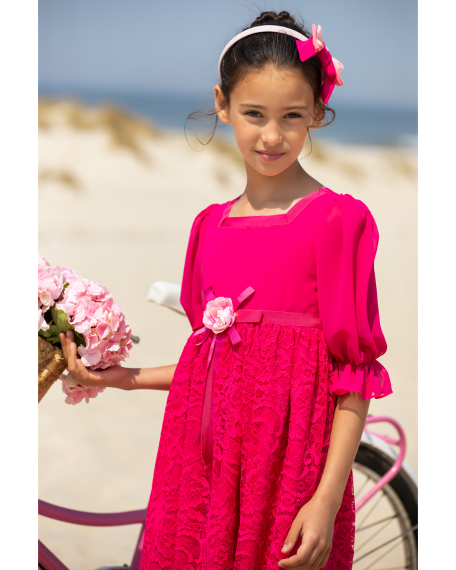 Fuchsia pink dress with bow and flower